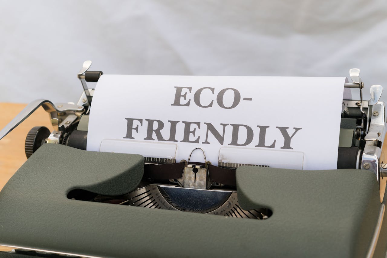 Typewriter printing 'Eco-Friendly' on paper, promoting sustainability.